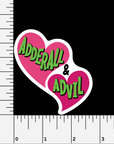 A sticker featuring 2 bright pink hearts with the text "adderall & advil" in bright green shown on a black background with measurements to indicate that the sticker is 3" high.