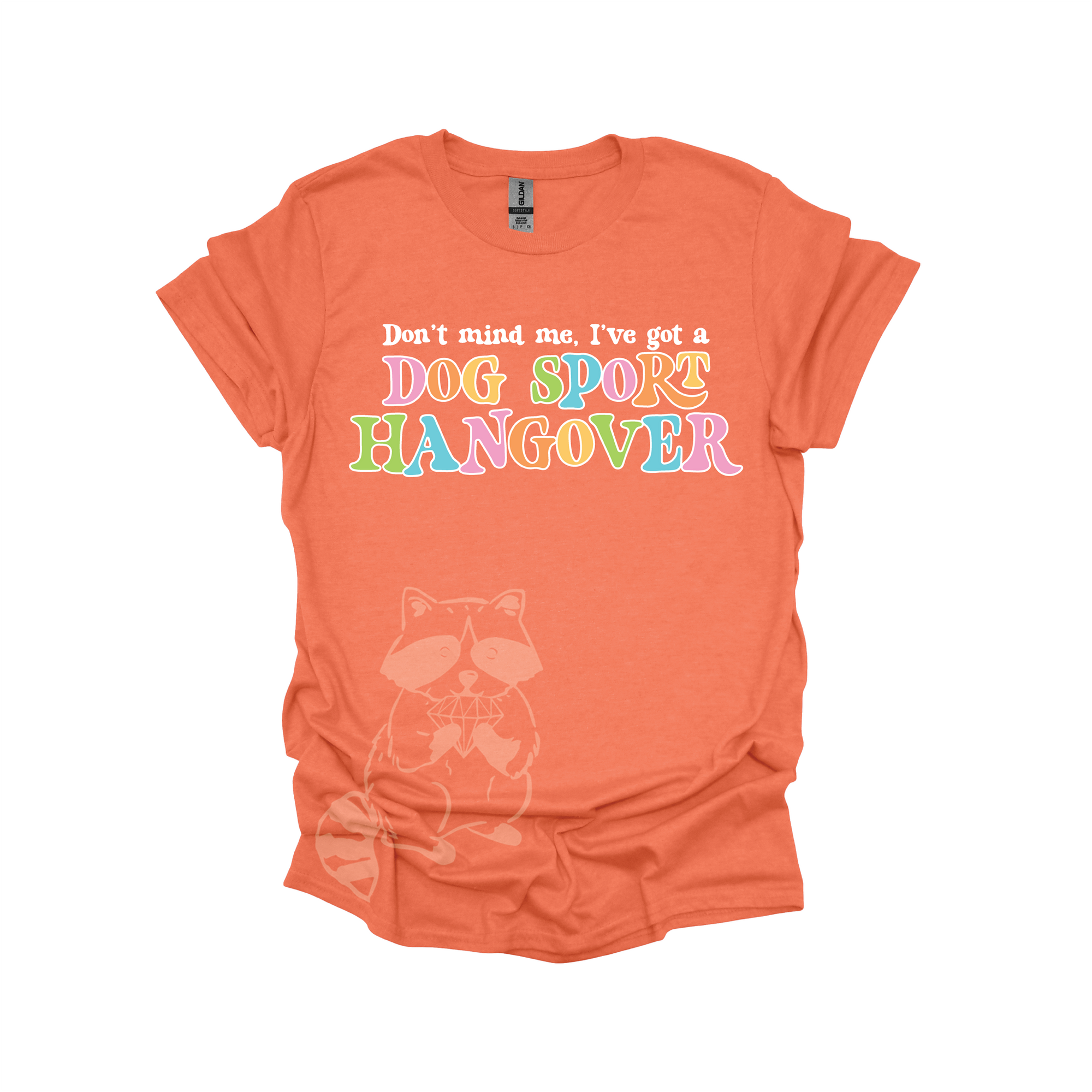 Orange t-shirt with colorful text that reads, "Don't mind me, I've got a DOG SPORT hangover".