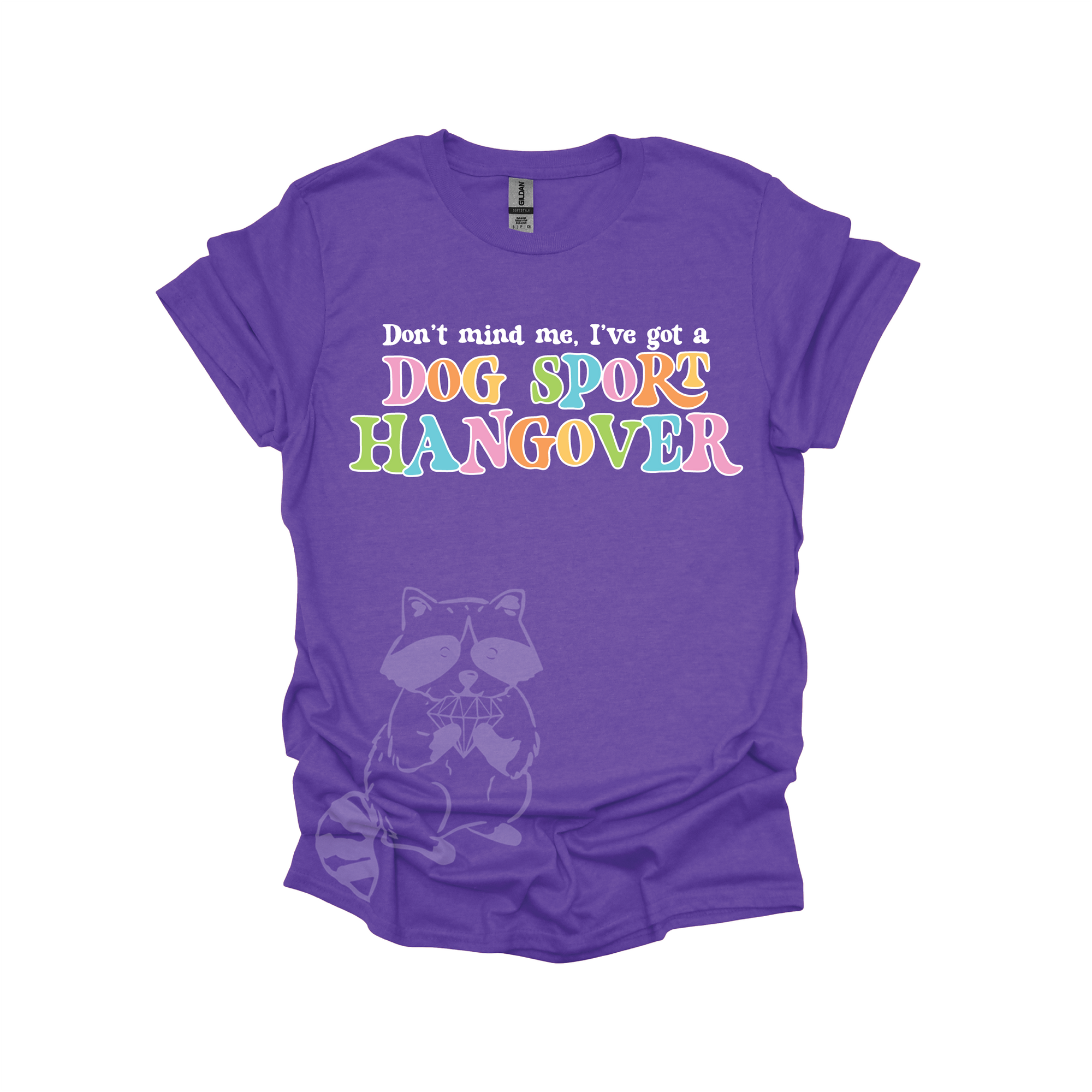 Purple t-shirt with colorful text that reads, "Don't mind me, I've got a DOG SPORT hangover".