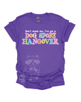 Purple t-shirt with colorful text that reads, "Don't mind me, I've got a DOG SPORT hangover".