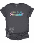 "Even My Dog Is A Feminist" printed in a pastel rainbow gradient in a vintage font on a graphite t-shirt.