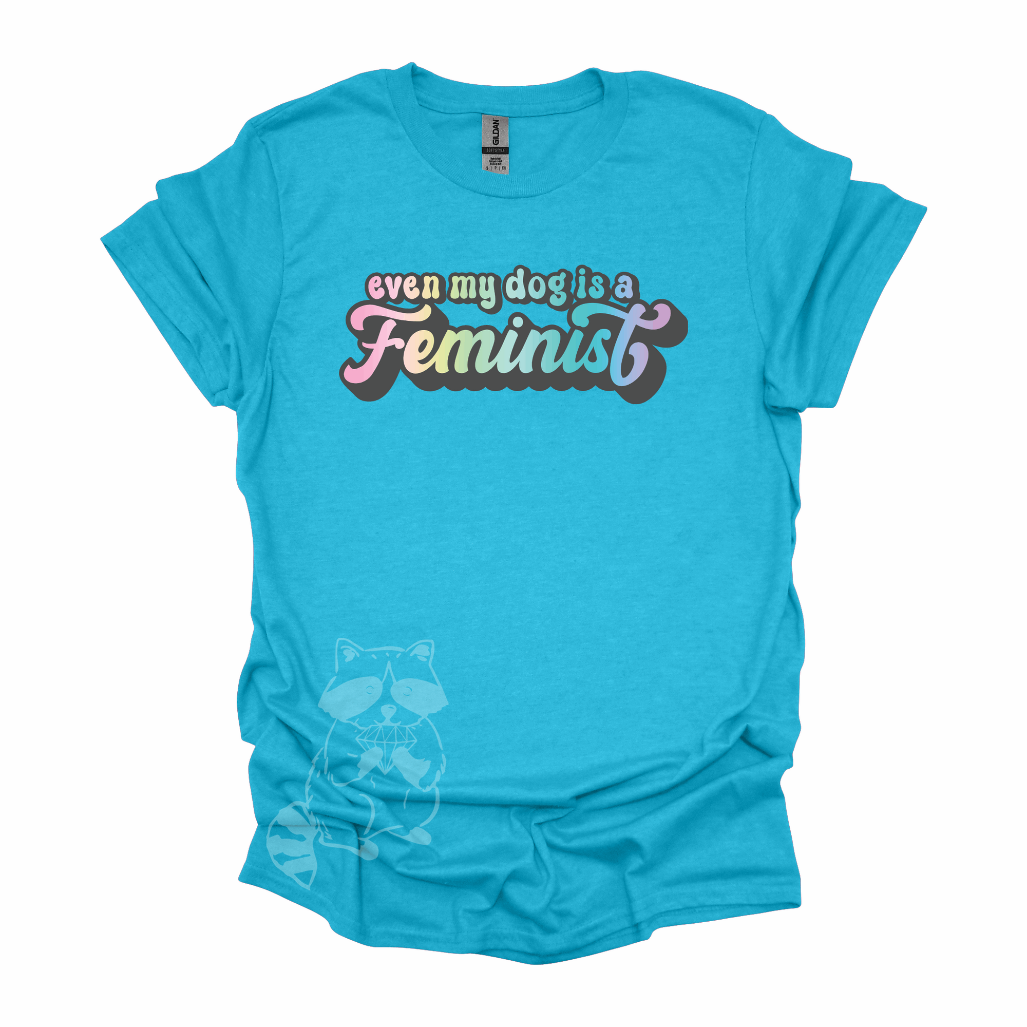 "Even My Dog Is A Feminist" printed in a pastel rainbow gradient in a vintage font on a laguna blue t-shirt.