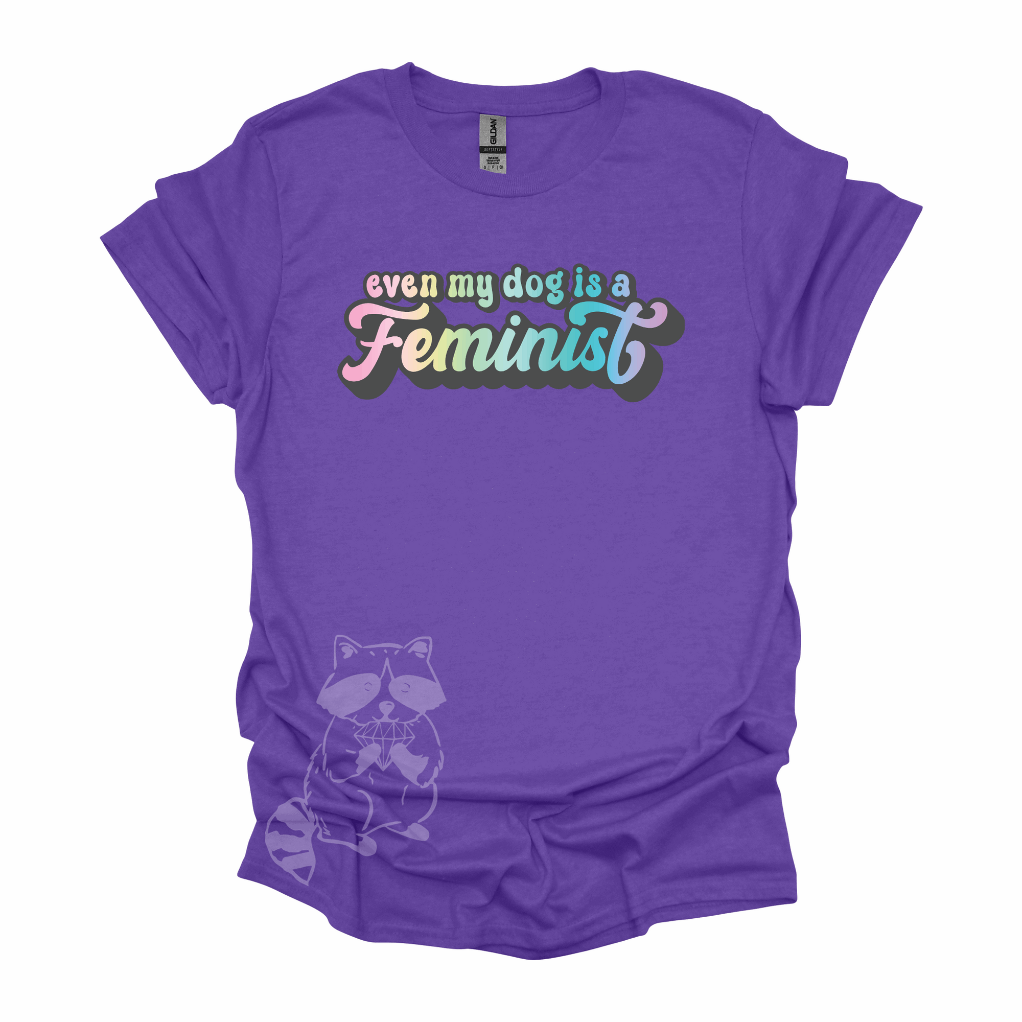 "Even My Dog Is A Feminist" printed in a pastel rainbow gradient in a vintage font on a purple t-shirt.