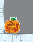 An orange and green colored pumpkin shaped sticker with the red text "it's about to get spicy!" on a background with measurements to show the sticker is 2" in size.