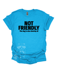 A bright blue shirt with the text "NOT FRIENDLY the dog is also sketchy af" printed in black.