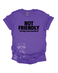 A purple t-shirt with the text "NOT FRIENDLY the dog is also sketchy af" printed in black.