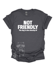 A grey t-shirt with the text "NOT FRIENDLY the dog is also sketchy af" printed in white.