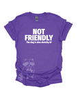 A purple t-shirt with the text "NOT FRIENDLY the dog is also sketchy af" printed in white.