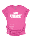 A pink t-shirt with the text "NOT FRIENDLY the dog is also sketchy af" printed in white.